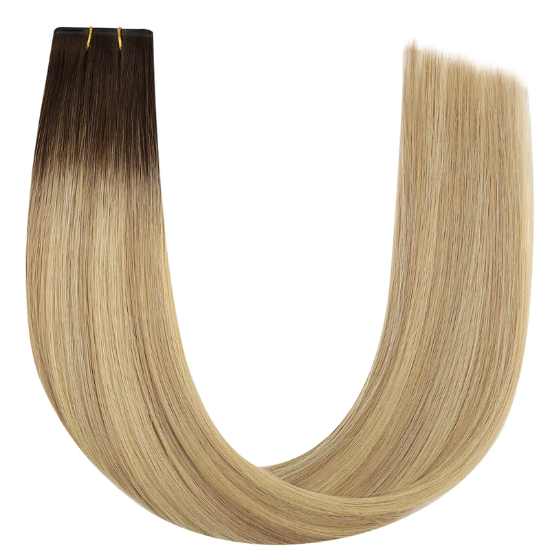 Load image into Gallery viewer, Blonde butterfly weft hair extensions with a gradient to brown on a white background
