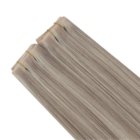 Blonde invisible butterfly weft hair exyensions on a white background